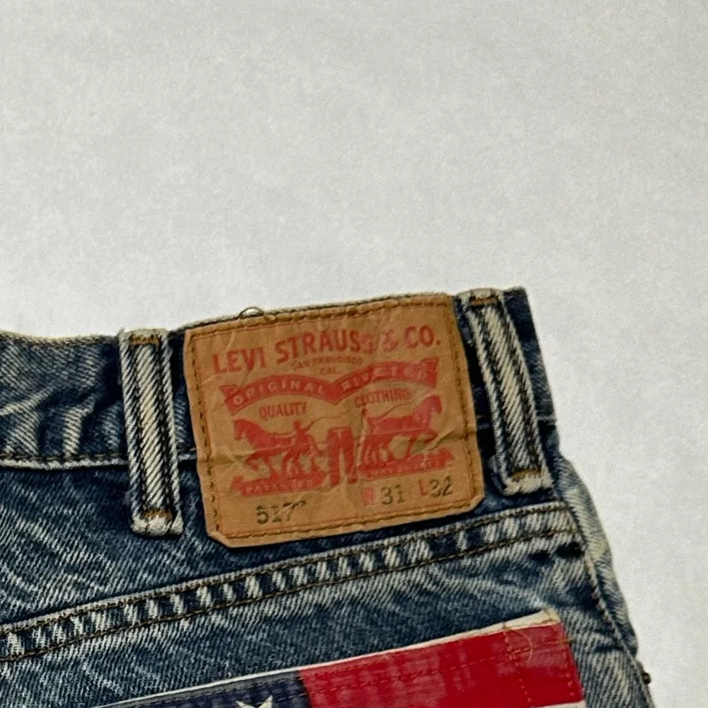 Levi's Distressed Denim Cutoff Shorts with American Flag Pocket - Picture 6 of 7
